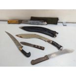 A group of knives to include a 1977 UK military Machete, a Victorian example Kukri and others,