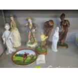 A group of ceramic, bronzed and resin figurines to include two Austin sculptures of golfers,