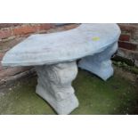A modern outdoor curved garden seat on two plinths, 42cm h x 90cm w, Location: G