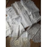 A quantity of 20th Century table linen with machine made crotchet insertions and trims together with