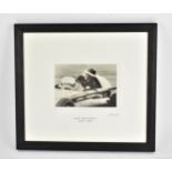 A signed reprinted photograph of Mike Hawthorne 1929-1959, racing in a Ferrari, printed with the