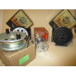 A Shakespeare 1960 Ciriterion reel and box, a Featherflow Strikeright reel and two J W Young