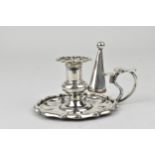 A 19th century Sheffield plate camber candlestick and snuffer of small proportions with shaped edges