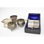 A cased pair of George V silver napkin rings by Charles Horner Ltd, Chester 1915, etched with floral