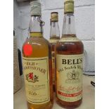 Four bottles of Bells whisky and one bottle of High Commissioner old scotch whisky, 1litre