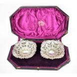 A cased pair of late Victorian silver dishes by George Nathan & Ridley Hayes, London 1887, with