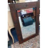 A 20th century leather and studwork wall mirror A/F 64cm x 93cm Location: RAM