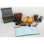 A mixed lot of collectables to include a boxed set of Thackery books, travel inkwell, binoculars,