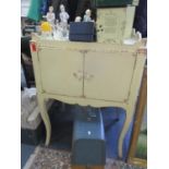 A cream painted cabinet with tray top on cabriole legs Location: RAF