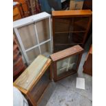 Four mid 20th century teak and painted collectors display cabinets, the largest 67cm h, 93cm w
