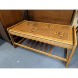 A retro style teak coffee table having a tile top, approx 96cm x 43cm Location: A4F