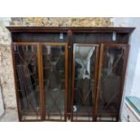 A large early 20th century mahogany bookcase with four astrigal glazed doors and shelves, 177cm h,
