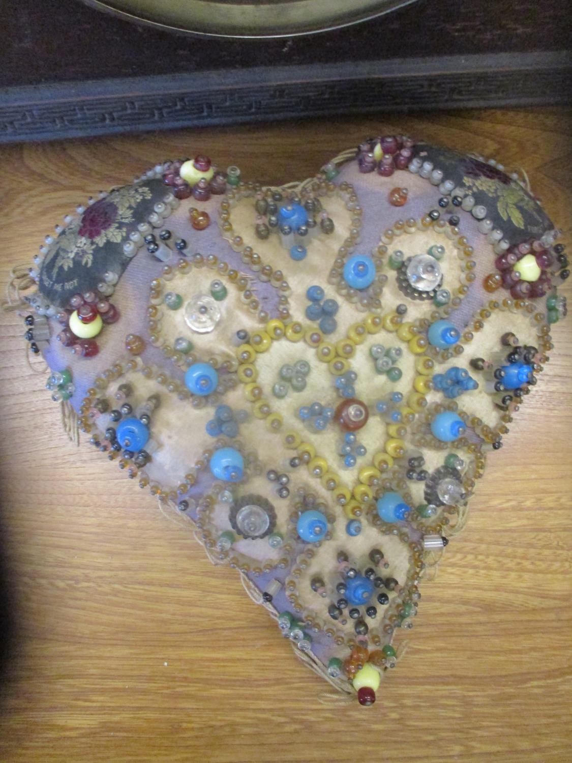 A 19th century heart shaped sweetheart cushion decorated with embroidered Forget me Nots and - Image 2 of 2