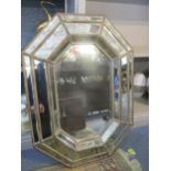 A modern Venetian style wall mirror of octagonal form with bevelled glass plate 83cm x 60cm