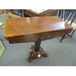 A William IV rosewood foldover card table on a circular turned column and three splayed feet, 74.5cm