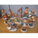 Ten Hummel figures to include one of a boy playing the cello