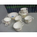A Minton Spring Bouquet set of ten cups, nine saucers, and nine side plates