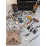 Items of interest housed in a black Victorian deed box to include Acme whistles, compasses,