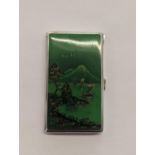 A stamped 925 silver cigarette case with green enamelled front of an Oriental scene with an engraved