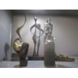 A group of contemporary bronze, brass and resin sculptures to include a patinated brass sculpture of