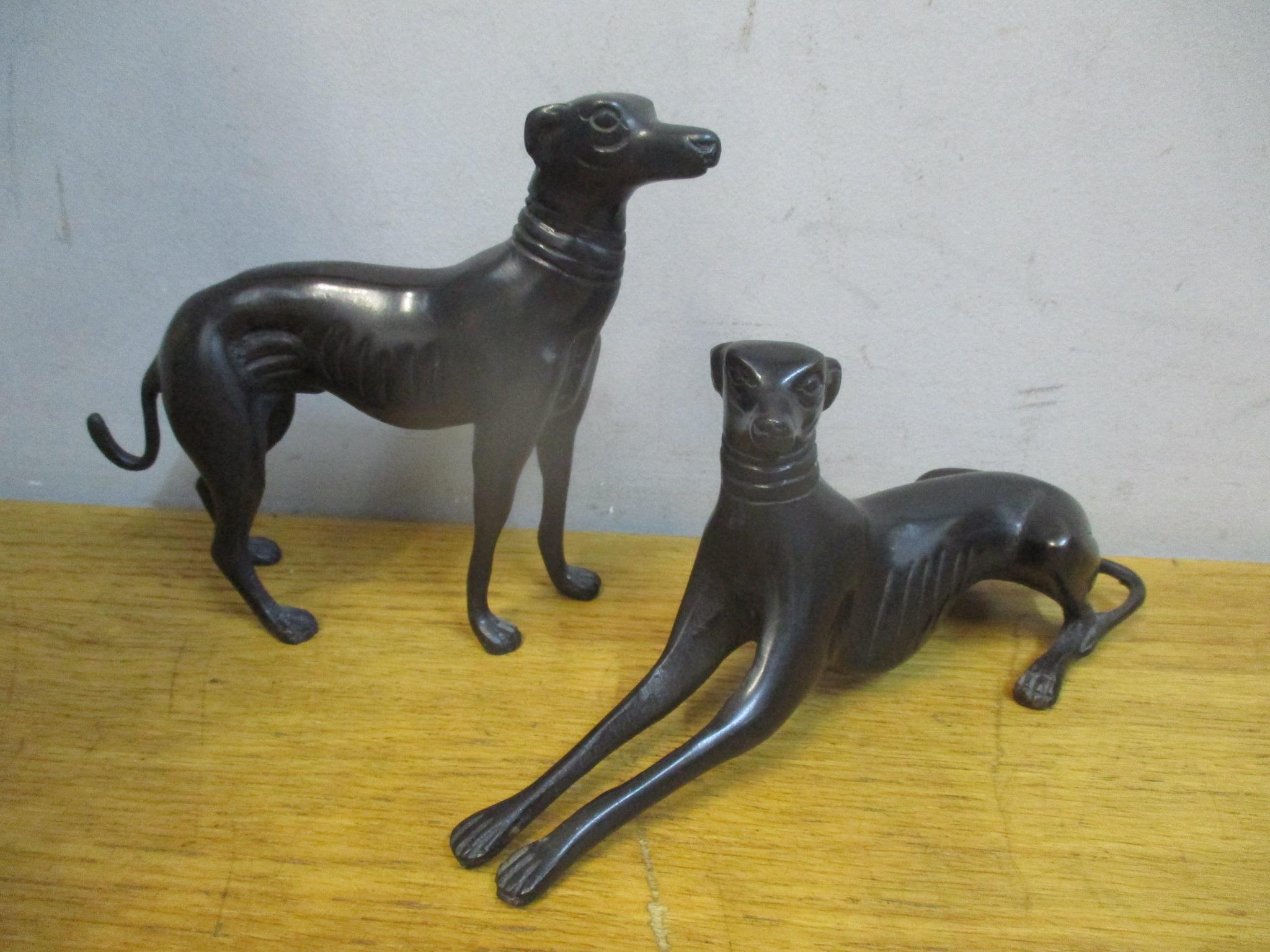 A pair of 20th century painted bronze model greyhounds Location: