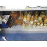 A collection of Doulton stoneware bottles, jars, whisky style barrel with wooden stands, various