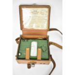 A vintage leather cased Megger circuit testing ohmmeter in green bakelite