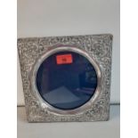 An ornate white metal and square form photo frame Location: porter