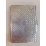 A silver engraved cigarette case, makers initials C.C, decorated with stars, weight 66.3g