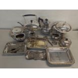 A mixed lot of silver plated items to include a Spirit kettle, grape scissors, coffee pot and others