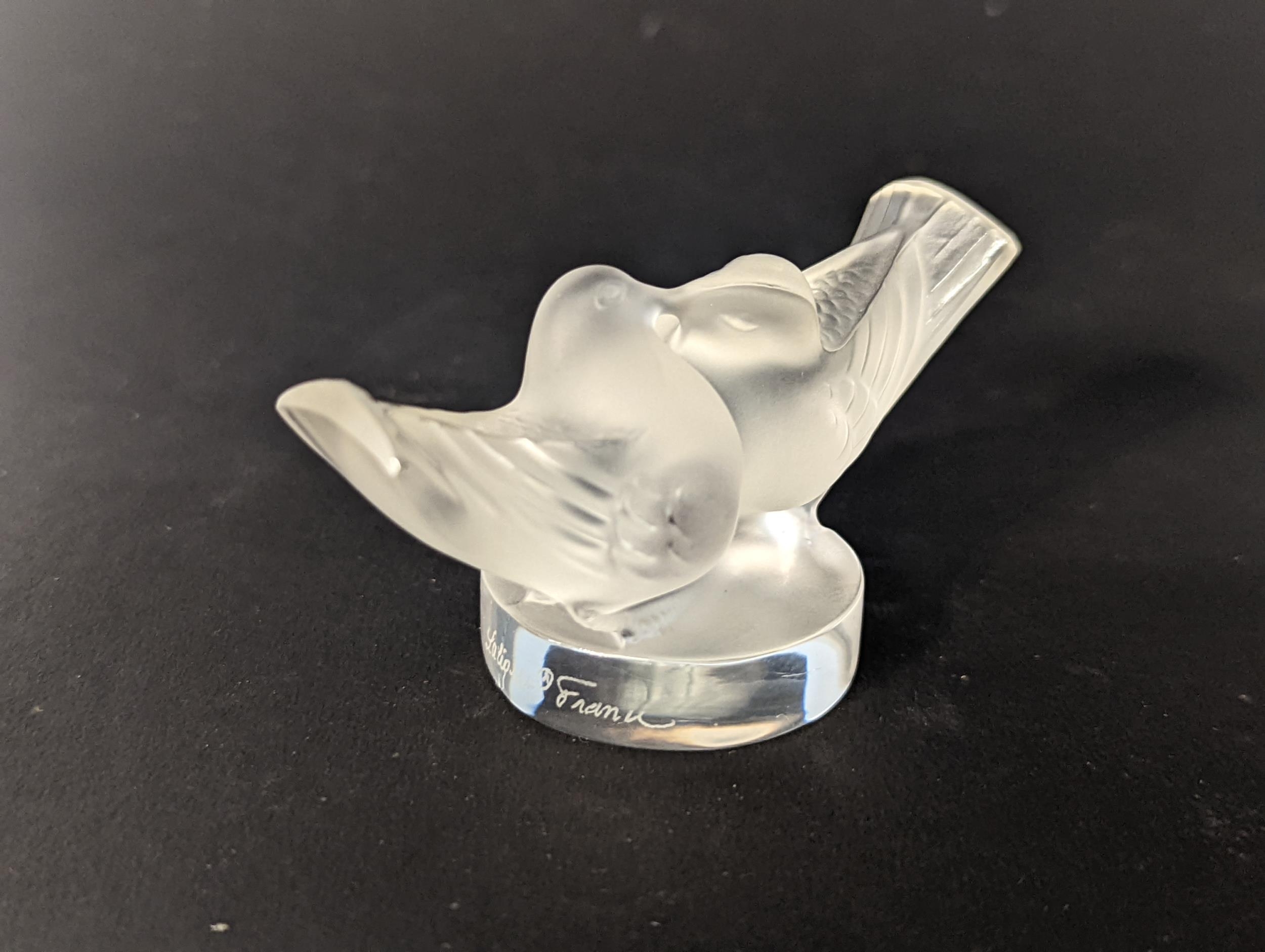 A Lalique frosted glass model of a pair of doves on a circular base, signed to side Location: