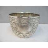 A Victorian silver sugar bowl with embossed floral decoration, 138.2g Location: