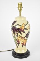 A Moorcroft Pottery Sumac Tree pattern table lamp base designed by Phillip Gibson, the body