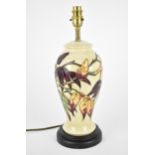 A Moorcroft Pottery Sumac Tree pattern table lamp base designed by Phillip Gibson, the body