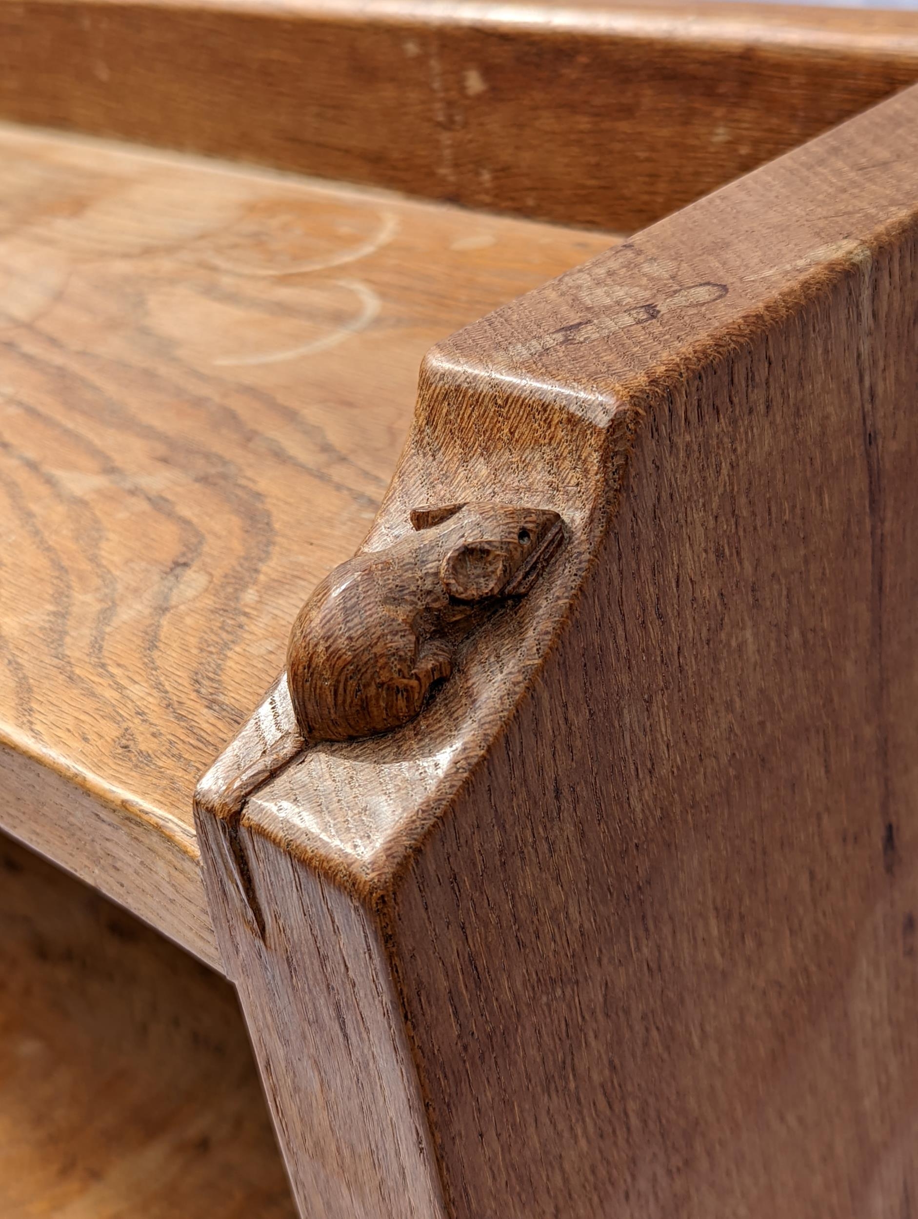 Robert 'Mouseman' Thompson of Kilburn (1876-1955), an oak bookcase, holding three shelves, the