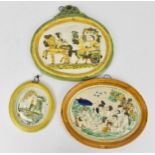 A small group of early 19th century prattware plaques, to include a bacchanalian scene with a