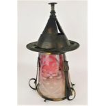 An Arts and Crafts period lantern, in the style of the hammered copper and brass fitting with