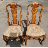 A pair of 18th century Dutch walnut and marquetry high back dining chairs, the inlaid splat