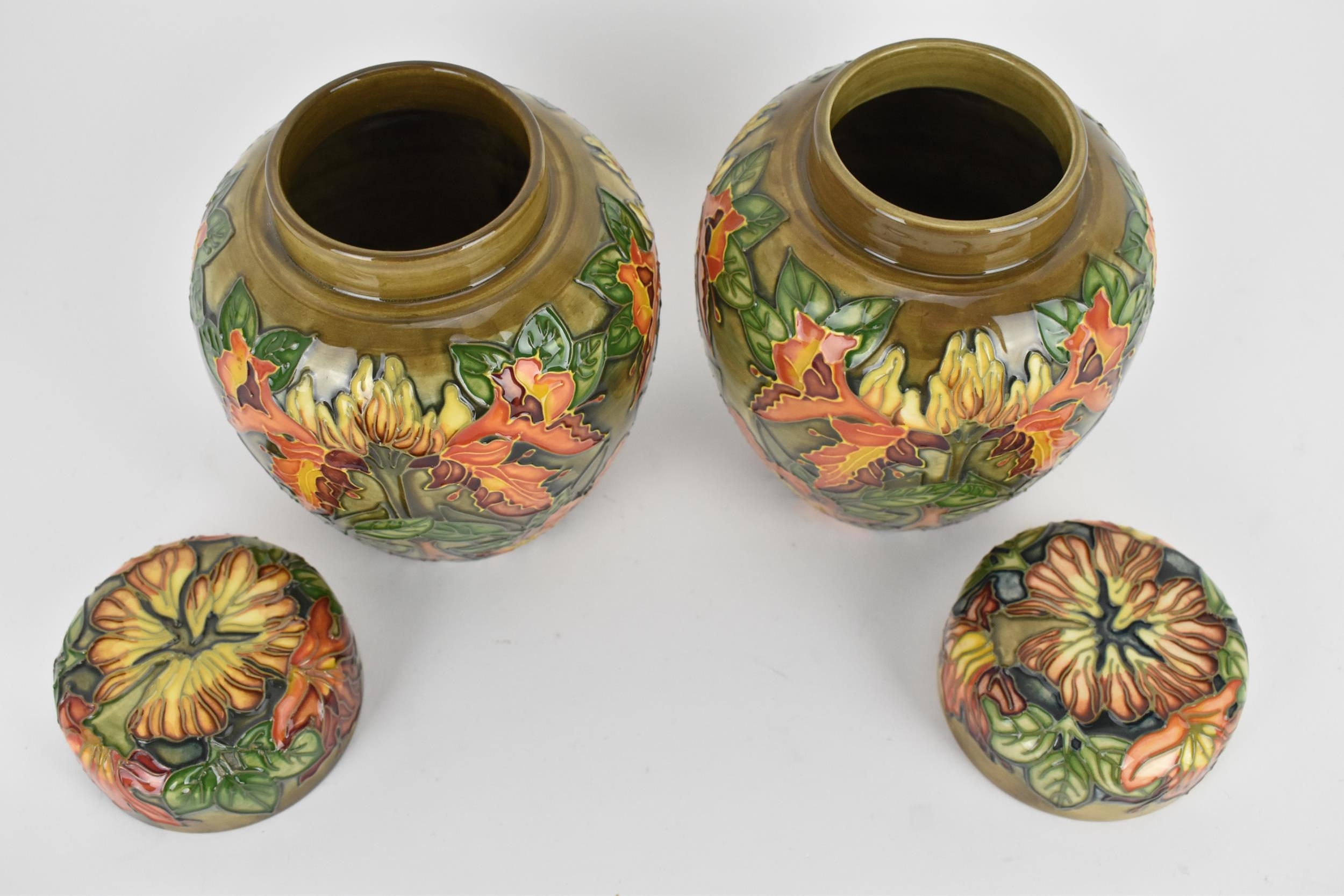 A pair of Moorcroft lidded ginger jars designed by Philip Gibson, in the 'Flame of the Forest' - Image 3 of 4