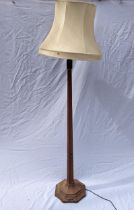 Robert 'Mouseman' Thompson of Kilburn (1876-1955), an oak standard lamp of faceted tapered form,