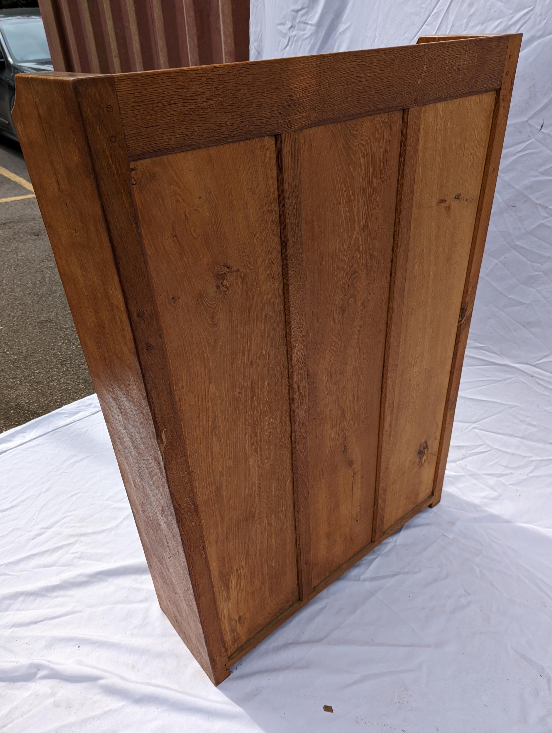 Robert 'Mouseman' Thompson of Kilburn (1876-1955), an oak bookcase, holding three shelves, the - Image 5 of 5