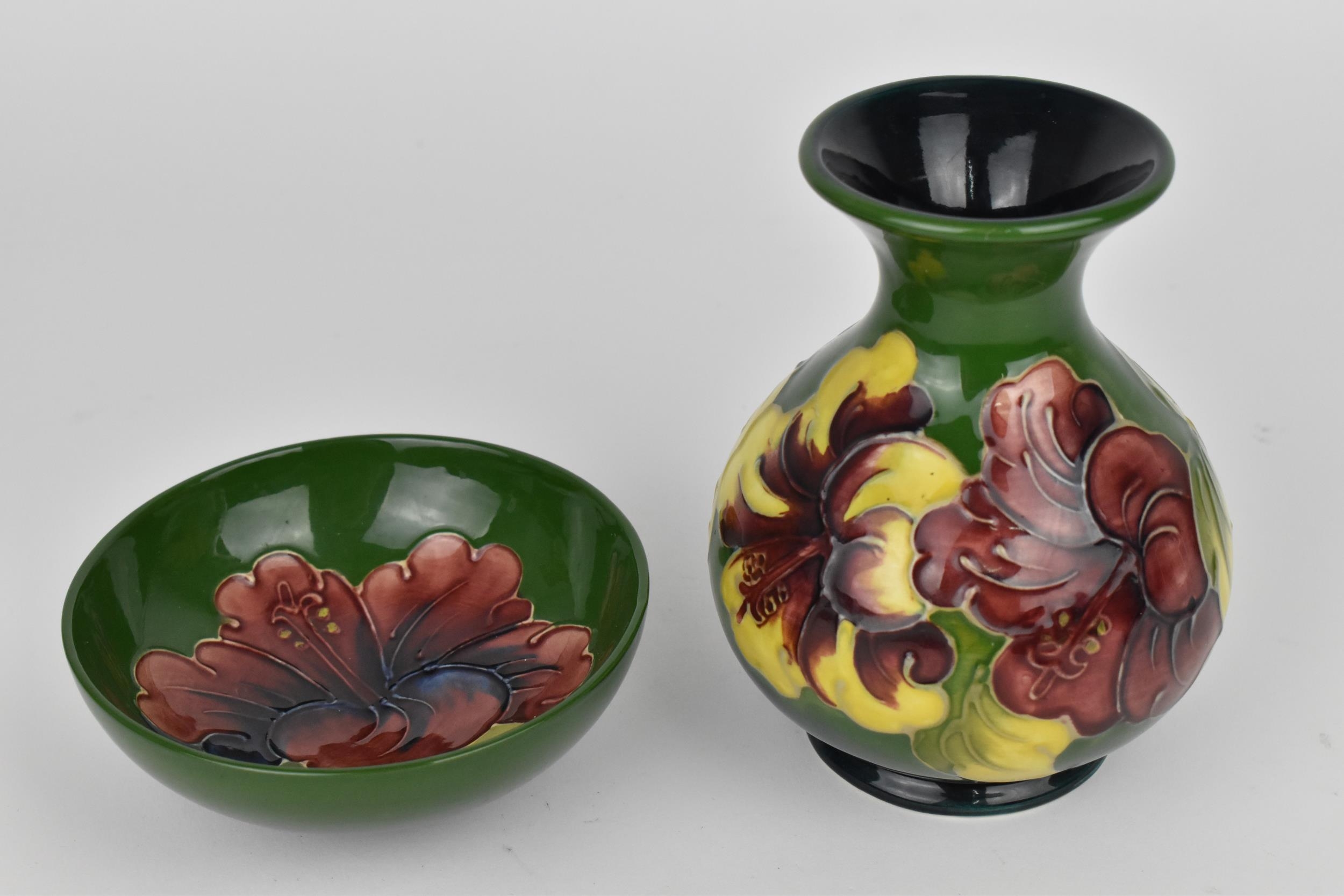 A Moorcroft pottery 'Hibiscus' pattern vase, designed with globular body and everted rim decorated - Image 3 of 6