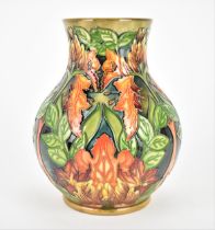 A late 20th century Moorcroft pottery vase designed by Philip Gibson, in the 'Flame of the Forest'