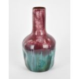 A late 19th century Linthorpe pottery dimple bottle vase designed by Christopher Dresser, shape