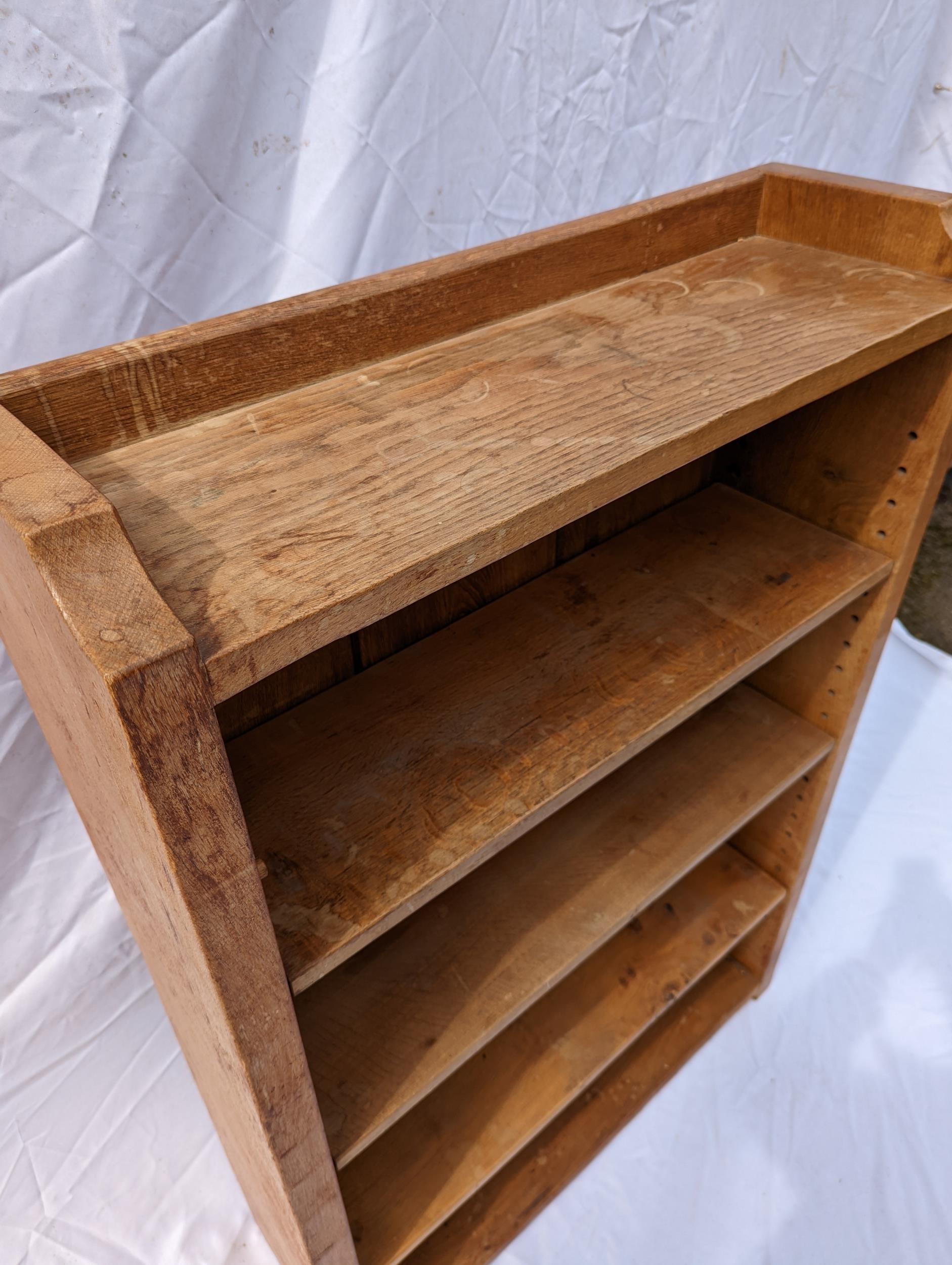 Robert 'Mouseman' Thompson of Kilburn (1876-1955), an oak bookcase, holding three shelves, the - Image 4 of 5