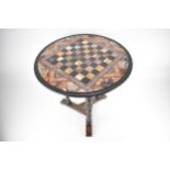 A late 19th century Aesthetic Movement oak and specimen marble side table, with inset chess board,
