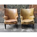 A pair of George III design barrel back armchairs, upholstered in studded tan leather, with button