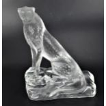 A Lalique "Tancrede Cheetah" frosted and clear crystal sculpture, the feline standing on a rock,