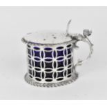 A Victorian silver mustard pot by William Hutton & Sons, London 1896, with pierced body and