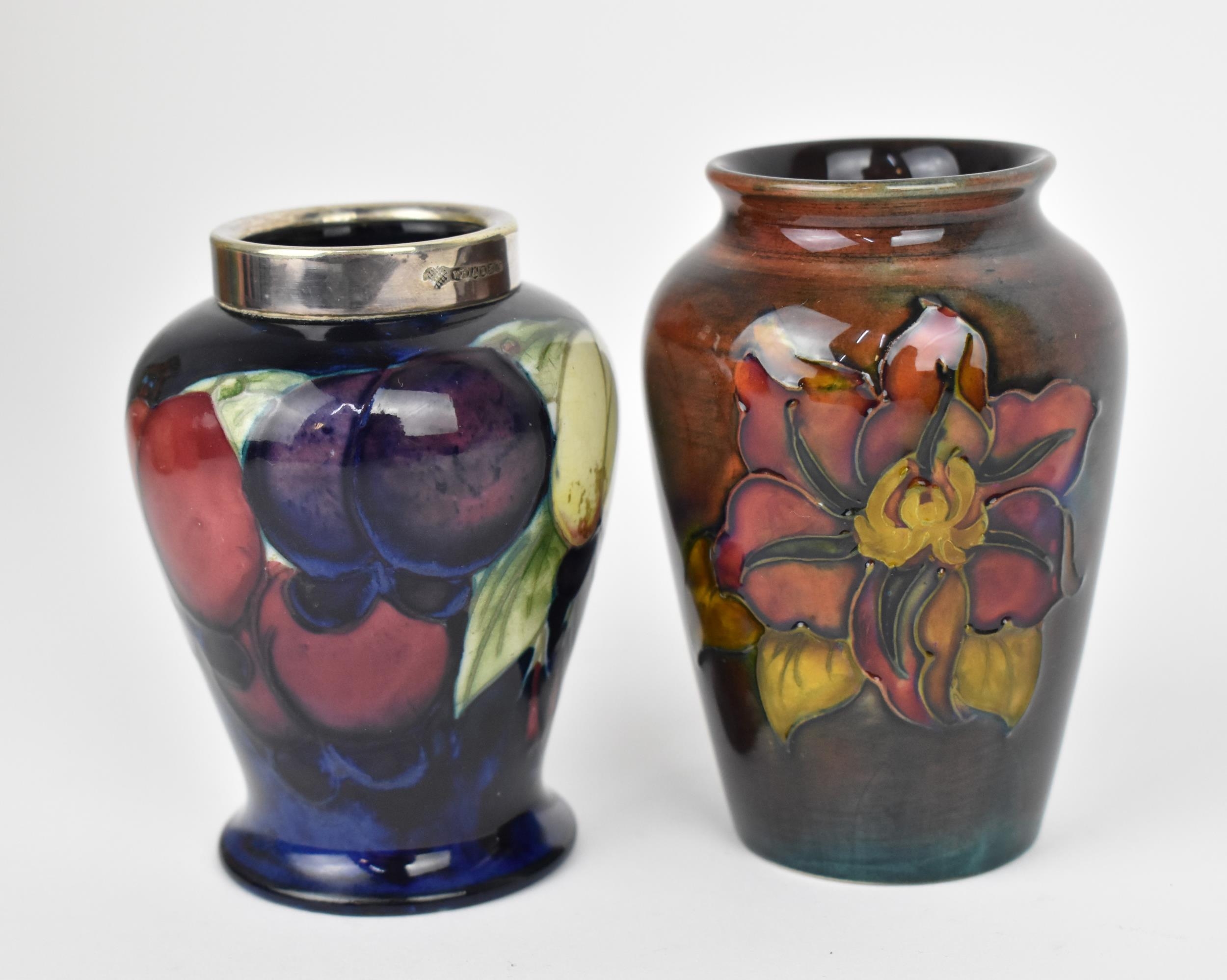 A Walter Moorcroft 'Clematis' pattern flambe vase, of tapered form with everted rim, the body with